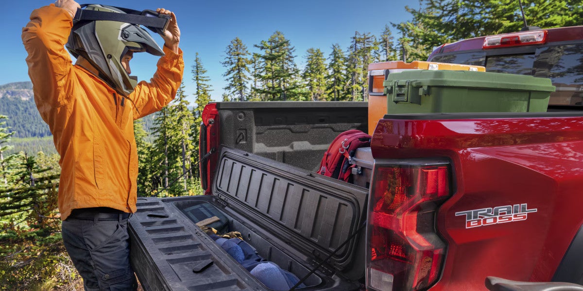StowFlex tailgate compartment open, showing storage bin
